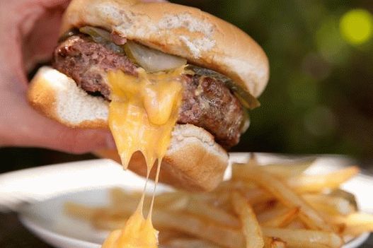 فوتو برجر مع شرحات مع جبنة في الداخل مع كاتشب حار